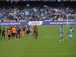 Players on the pitch at the Stadio Diego Armando Maradona stadium, viewed from the Curva A Inferiore grandstand, right after the football match SSC Napoli - Salernitana