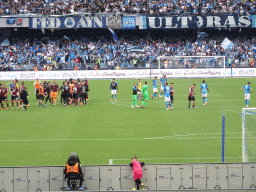 Players on the pitch at the Stadio Diego Armando Maradona stadium, viewed from the Curva A Inferiore grandstand, right after the football match SSC Napoli - Salernitana