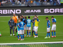 Players on the pitch at the Stadio Diego Armando Maradona stadium, viewed from the Curva A Inferiore grandstand, right after the football match SSC Napoli - Salernitana