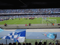 Players on the pitch at the Stadio Diego Armando Maradona stadium, viewed from the Curva A Inferiore grandstand, right after the football match SSC Napoli - Salernitana