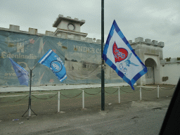 SSC Napoli flags in front of the Edenlandia at the Viale John Fitzgerald Kennedy street, viewed from the rental car