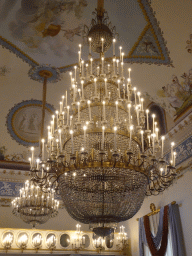 Chandeliers and frescoes on the ceiling of the Salone delle Feste room at the First Floor of the Museo di Capodimonte museum