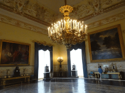 Paintings, clocks and chandelier at the First Floor of the Museo di Capodimonte museum