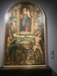 Painting `Madonna of Loreto and Saints John the Baptist and Sebastian` by Paolo degli Agostini at the exhibition `Gli Spagnoli a Napoli` at the Lower Floor of the Museo di Capodimonte museum, with explanation