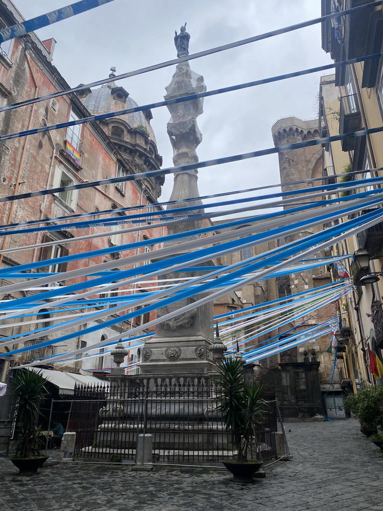 Decorations for SSC Napoli`s third Italian championship at the Piazza Cardinale Sisto Riario Sforza square with the Obelisco di San Gennaro obelisk and the southeast side of the Duomo di Napoli cathedral