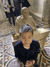 Max with a statue at the Crypt of San Gennaro at the Duomo di Napoli cathedral