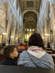 Miaomiao and Max on a bench at the nave of the Duomo di Napoli cathedral