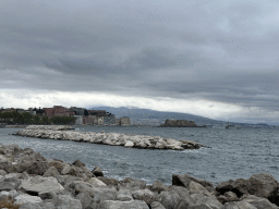 The beach at the Via Caracciolo Francesco street, with a view on the city center with the Castel dell`Ovo castle and Mount Vesuvius