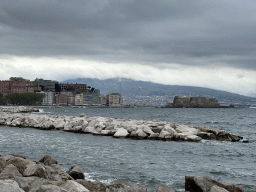The beach at the Via Caracciolo Francesco street, with a view on the city center with the Castel dell`Ovo castle and Mount Vesuvius
