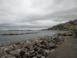 The beach at the Via Caracciolo Francesco street and boats at the Sannazaro Port