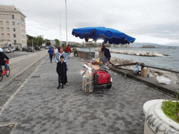 Miaomiao and Max with a candyfloss salesman at the beach at the Via Caracciolo Francesco street