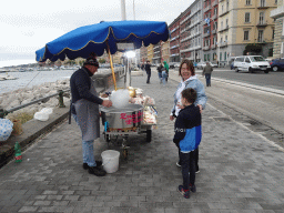 Miaomiao and Max getting a candyfloss at the beach at the Via Caracciolo Francesco street