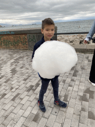 Max with a candyfloss at the beach at the Via Caracciolo Francesco street