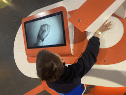 Max doing a hand movement game at the Corporea building at the east side of the Città della Scienza museum