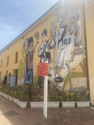 Wall painting and signpost at the west side of the Città della Scienza museum