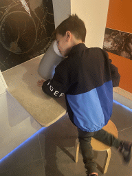 Max looking through a microscope at the Bugs & Co building at the west side of the Città della Scienza museum