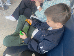 Max playing FIFA 23 on the Nintendo Switch at the Departures Hall of Naples International Airport