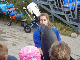 Zookeeper, California Sea Lion and the audience at the Deltapark Neeltje Jans, during the Sea Lion Show