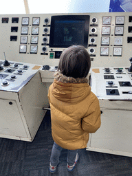 Max at the control panel of a dam at the Delta Expo at the Deltapark Neeltje Jans