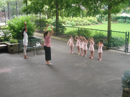 Children learning ballet in a park in south-Manhattan