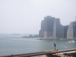 View on Manhattan and Liberty Island with the statue of Liberty, from Brooklyn Bridge