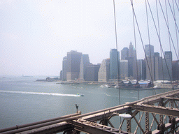 View on Manhattan and Liberty Island with the statue of Liberty, from Brooklyn Bridge