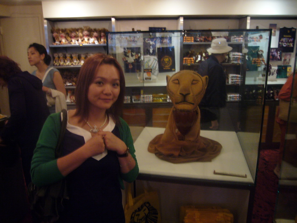 Miaomiao and a lion head from the musical `The Lion King`