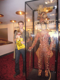 Tim with a plush Lion King, and a lion suit from the musical `The Lion King`
