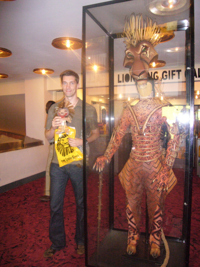 Tim with a plush Lion King, and a lion suit from the musical `The Lion King`