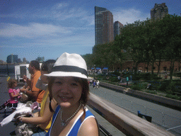 Miaomiao on the Liberty Island ferry, with view on Battery Park