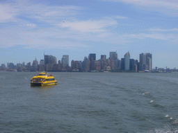 The skyline of Manhattan and a boat, from the Liberty Island ferry