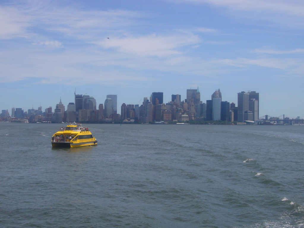 The skyline of Manhattan and a boat, from the Liberty Island ferry