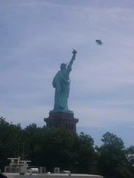 The back side of the Statue of Liberty and a zeppelin