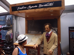 Miaomiao and a wax statue of Frédéric Auguste Bartholdi