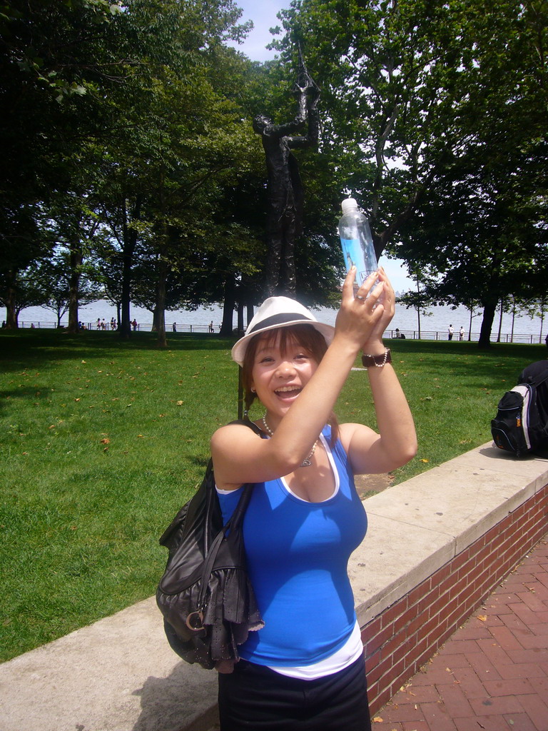 Miaomiao and a small statue of Frédéric Auguste Bartholdi