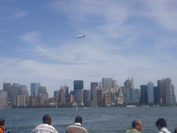 The skyline of Manhattan, and a zeppelin, from the Liberty Island - Ellis Island ferry