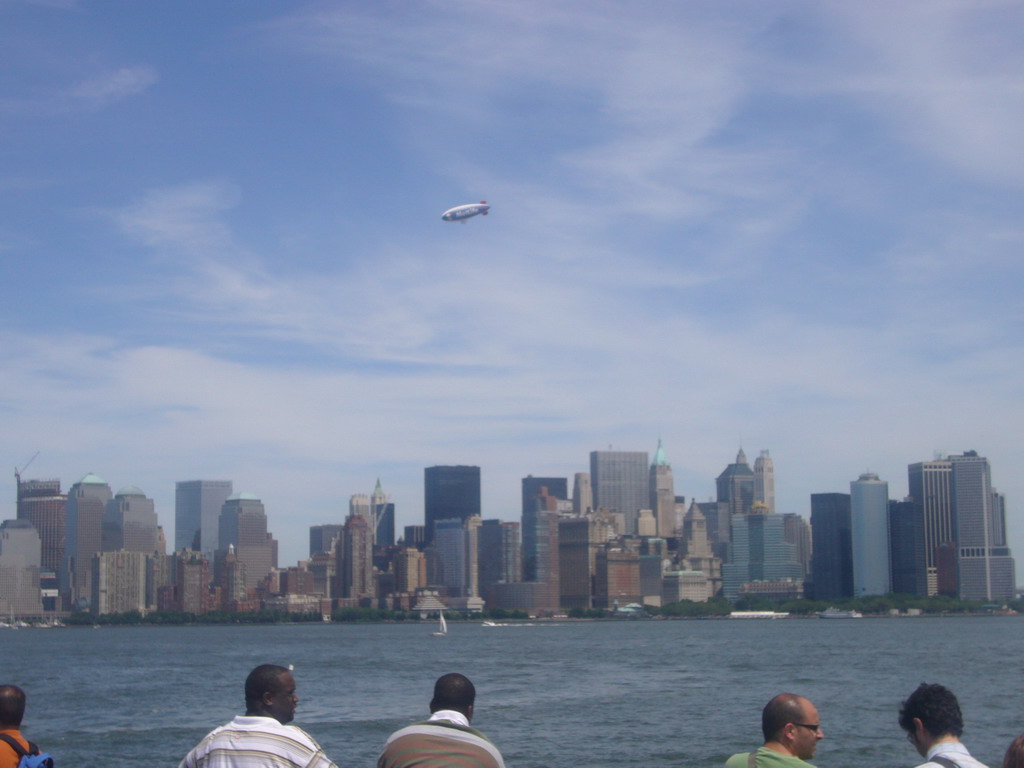 The skyline of Manhattan, and a zeppelin, from the Liberty Island - Ellis Island ferry