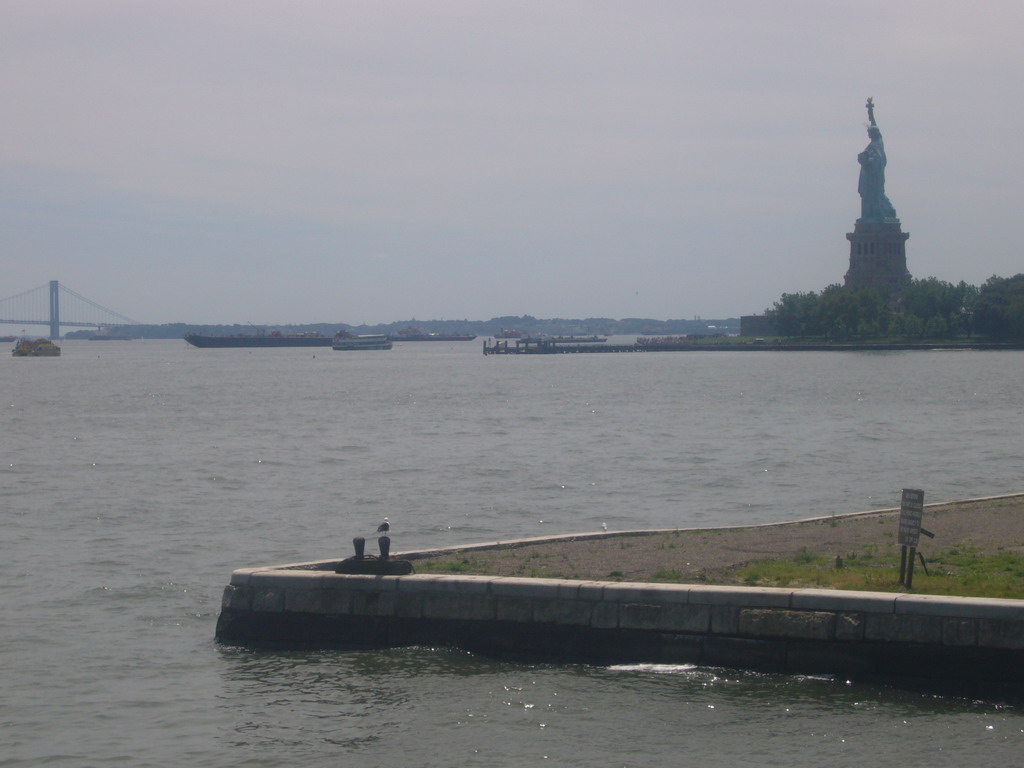 Liberty Island, boats and Brooklyn Bridge, from Ellis Island