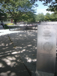 Miaomiao at the American Immigrant Wall of Honor, with explanation, on Ellis Island