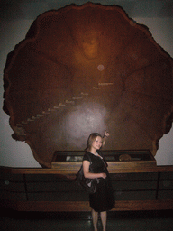 Miaomiao with a cross section of a tree, in the American Museum of Natural History