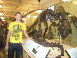 Tim with a skeleton of an Allosaurus, in the Hall of Saurischian Dinosaurs, in the American Museum of Natural History
