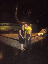 Tim and Miaomiao with a dinosaur model, in the American Museum of Natural History