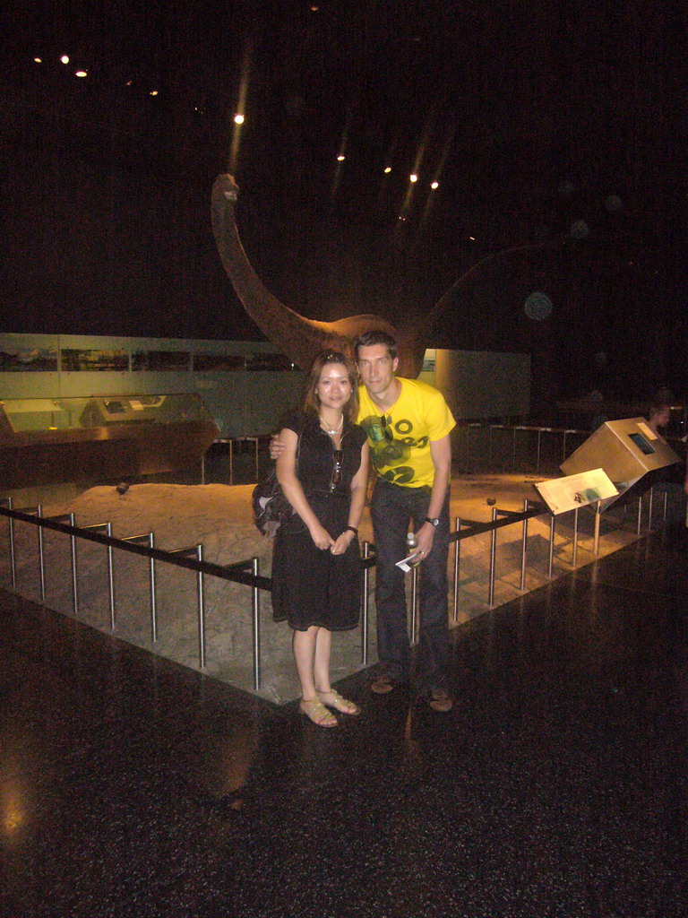 Tim and Miaomiao with a dinosaur model, in the American Museum of Natural History