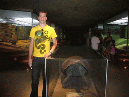 Tim with a model of a turtle, in the American Museum of Natural History