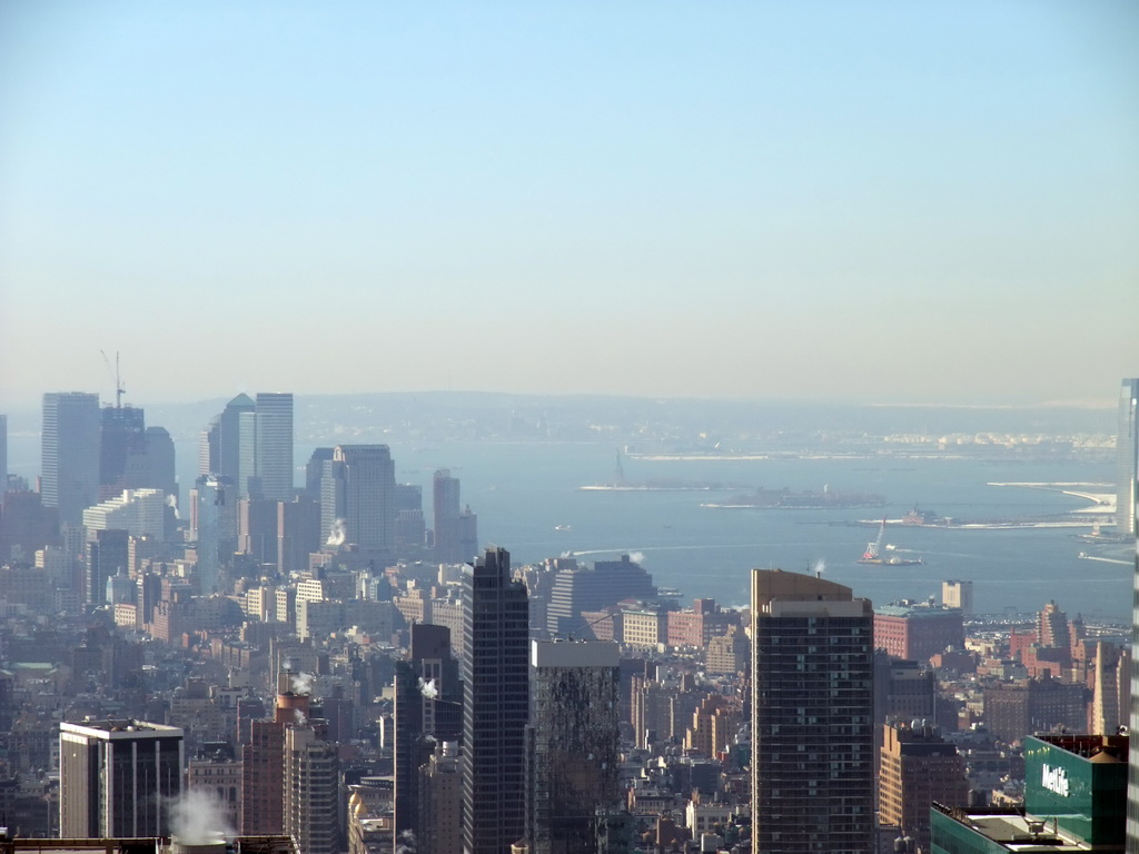Southwest side of Manhattan, the Hudson River, Liberty Island with the Statue of Liberty and Ellis Island, viewed from the `Top of the Rock` Observation Deck at the GE Building of Rockefeller Center