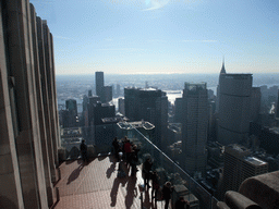 The `Top of the Rock` Observation Deck at the GE Building of Rockefeller Center, with a view on the west side of Manhattan with the Chrysler Building, the MetLife Building, the 383 Madison Avenue building and the East River