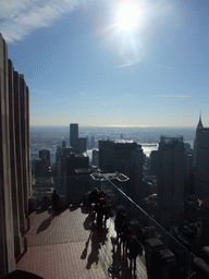 The `Top of the Rock` Observation Deck at the GE Building of Rockefeller Center, with a view on the west side of Manhattan with the Chrysler Building, the MetLife Building, the 383 Madison Avenue building and the East River