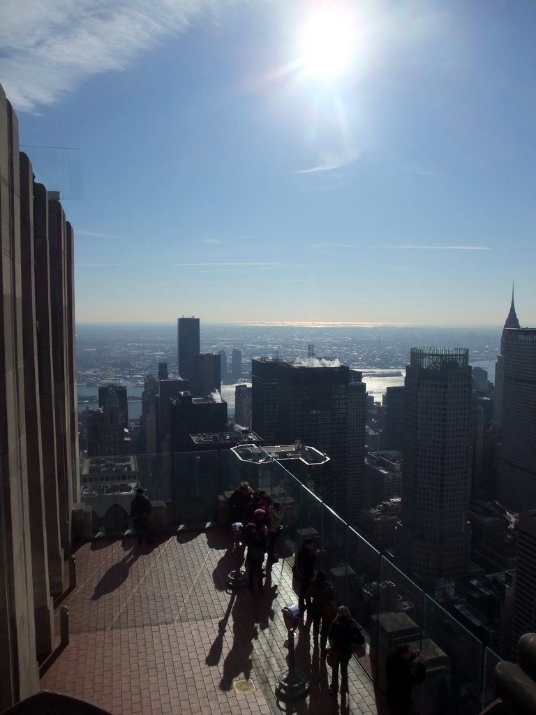 The `Top of the Rock` Observation Deck at the GE Building of Rockefeller Center, with a view on the west side of Manhattan with the Chrysler Building, the MetLife Building, the 383 Madison Avenue building and the East River