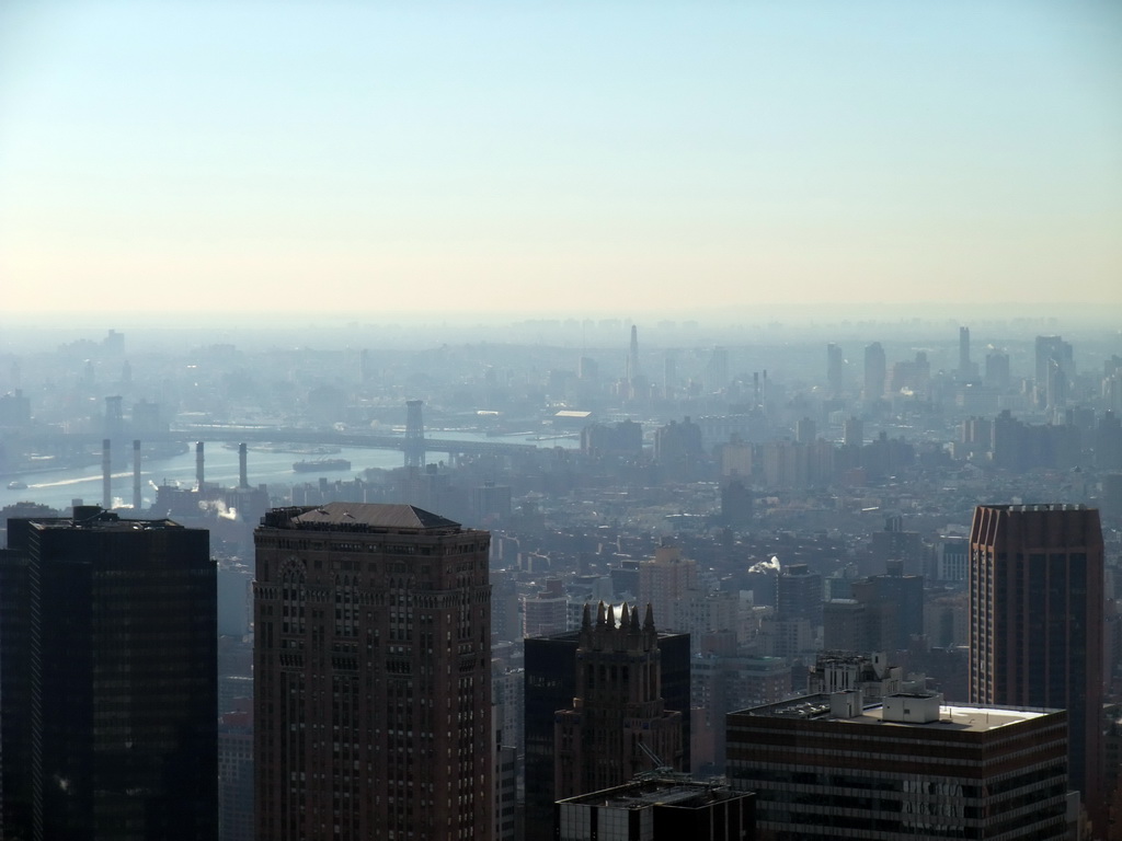 Southeast side of Manhattan with the Williamsburg Bridge over the East River, viewed from the `Top of the Rock` Observation Deck at the GE Building of Rockefeller Center