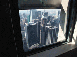 The Bank of America Tower and the Condé Nast Building and surroundings, viewed through a window at the `Top of the Rock` Observation Deck at the GE Building of Rockefeller Center
